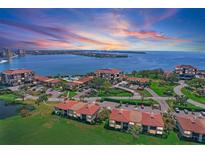 Stunning aerial view of the condo community with beautiful landscaping and water views during sunset at 6158 Palma Del Mar S Blvd # 406, St Petersburg, FL 33715
