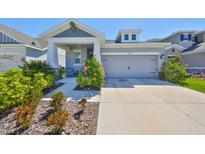 Charming single-story home with well-maintained landscaping, inviting curb appeal, and attached garage at 5523 Del Coronado Dr, Apollo Beach, FL 33572