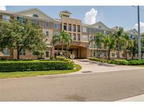 Beautiful building featuring lush landscaping and a convenient covered entrance at 4221 W Spruce St # 2205, Tampa, FL 33607