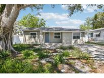 Charming home featuring a neutral color scheme, well-maintained landscaping, and inviting curb appeal at 1000 8Th Sw Ave, Largo, FL 33770