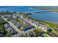 Beautiful aerial view of waterfront townhomes with stunning water and bridge views at 1010 Mango Ct, Oldsmar, FL 34677