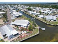 Waterfront property with canal access, landscaping, and outdoor decor in this charming residential community at 131 E Saint Annes Cir, Apollo Beach, FL 33572