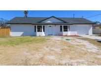 Charming single-story home featuring a new roof, fresh paint, and an attached garage at 807 Nectar Rd, Venice, FL 34293