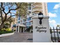 Bayshore Regency entrance with well-manicured landscaping and elegant architecture showcasing a luxurious, welcoming facade at 3435 Bayshore Blvd # 1401S, Tampa, FL 33629