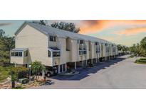 Coastal townhome with beachy vibe and front carports, near area attractions at 1500 Sunset Rd # G4, Tarpon Springs, FL 34689