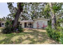 Charming single-story home with lush landscaping and mature trees in a quiet neighborhood at 10514 52Nd N Ave, St Petersburg, FL 33708