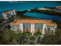Stunning aerial view of condo building with manicured grounds and beautiful bay views at 4801 Osprey S Dr # 508, St Petersburg, FL 33711