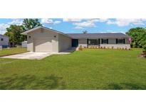 Charming single-story home boasting a lush green lawn and a well-maintained exterior at 12006 Glenshire Dr, Riverview, FL 33579