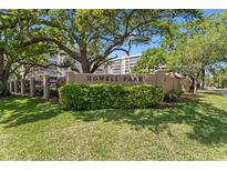 Howell Park signage with mature trees and lush landscaping against a blue sky backdrop at 2403 S Ardson Pl # 902B, Tampa, FL 33629