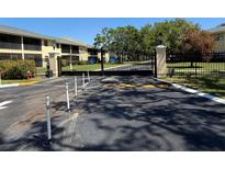 Gated entrance to the community with mature landscaping and well-maintained grounds at 3001 58Th Ave S # 1103, St Petersburg, FL 33712