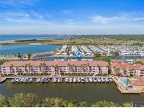 Enjoy waterfront living with beautiful condo community and boat docks, near a large body of water at 5000 Culbreath Key Way # 8-308, Tampa, FL 33611
