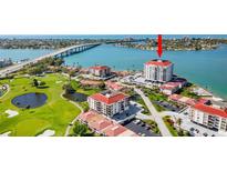 Panoramic aerial view showcases the condo's golf course frontage, tennis courts, and amazing views of the bay at 6265 Sun Blvd # 1201, St Petersburg, FL 33715