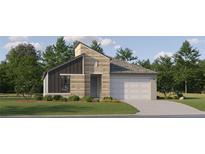Modern home featuring varied textures, attached garage, and beautifully landscaped front yard at 9340 Gladsome Dr, Land O Lakes, FL 34637