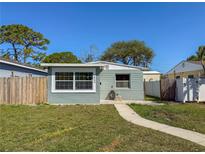 Charming single-story home featuring a well-maintained lawn and walkway leading to the front entrance at 2869 36Th N Ave, St Petersburg, FL 33713
