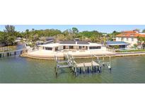 Waterfront home featuring a private dock and boat lift offering convenient access to the open water at 2970 68Th S Ave, St Petersburg, FL 33712