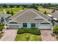 Charming single story home with a well-manicured lawn and attached two car garage at 604 Mcdaniel St, Sun City Center, FL 33573