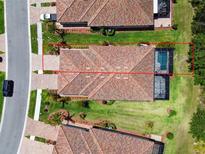 Aerial view of a home with a tile roof, screened pool, and well-maintained landscaping at 12379 Amica Loop, Venice, FL 34293