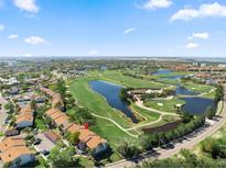 Beautiful aerial view of golf course community with lakes and meticulously landscaped grounds in a desirable neighborhood at 1901 Oyster Catcher Ln # 823, Clearwater, FL 33762