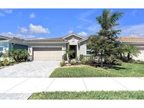Charming one-story home with a two-car garage and well-maintained landscaping at 20647 Ovid Ln, Venice, FL 34293