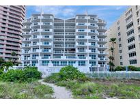 Stunning beachfront condo with multiple balconies offering panoramic ocean views and lush landscaping at 1350 Gulf Blvd # 301, Clearwater Beach, FL 33767