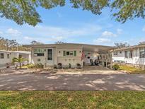 Charming single-story home with well-maintained landscaping and a convenient covered parking area at 2331 Belleair Rd # 214, Clearwater, FL 33764