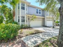 Charming two-story home featuring a two-car garage and well-maintained landscaping at 2874 Bayshore Trails Dr, Tampa, FL 33611