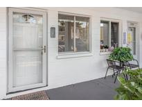 Inviting front porch with seating and charming details adds to the welcoming entrance of this home at 1552 Pleasant Rd # J4, Bradenton, FL 34207