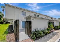 Charming townhome featuring a private entrance and well-maintained landscaping at 4201 La Palma Ct, Tampa, FL 33611