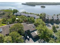 Stunning aerial view of waterfront property with lush landscaping and serene water views at 1111 N Bayshore Blvd # E3, Clearwater, FL 33759