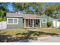 Charming single-story home features a cozy front porch, well-maintained lawn and tidy landscaping at 2125 Acorn S Pl, St Petersburg, FL 33712