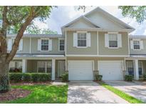 Inviting two-story townhome with a one car garage and charming curb appeal at 220 Sawtooth Dr, Valrico, FL 33594