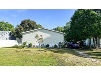 Charming single-story home featuring a spacious yard and a convenient driveway for easy parking at 6051 106Th N Ave, Pinellas Park, FL 33782