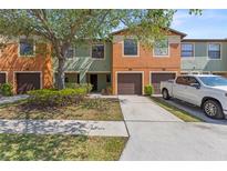 Inviting multi-colored townhome with well-manicured lawn and mature trees at 2441 Hibiscus Bay Ln, Brandon, FL 33511