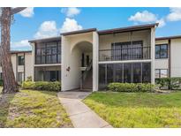 Charming condo with private screened balconies and well maintained landscaping at 2699 Pine Ridge E Way # H1, Palm Harbor, FL 34684