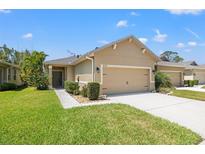Charming single-story home featuring a two-car garage and well-maintained landscaping in a quiet neighborhood at 8078 Pine Crest St, Seminole, FL 33777