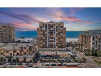 Beautiful exterior shot of this high rise beachfront condo with a view of the beach at sunset at 11 Baymont St # 1109, Clearwater Beach, FL 33767