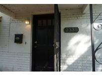 Charming front door with black hardware and brick accents at 2335 Murilla S Way, St Petersburg, FL 33712