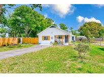 Charming single-story home with a well-manicured lawn and inviting front porch at 3435 40Th N St, St Petersburg, FL 33713