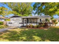 Charming single-story home boasts fresh landscaping and a one car garage at 5809 Dartmouth N Ave, St Petersburg, FL 33710