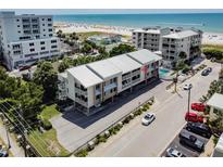 Beautiful building with balconies, a pool, and beach access offering the ultimate coastal living experience at 15 Glendale St # B6, Clearwater Beach, FL 33767
