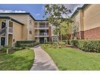 Attractive condo complex featuring lush landscaping and well-maintained common areas at 4107 Chatham Oak Ct # 326, Tampa, FL 33624
