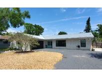 Charming single-story home with a well-maintained front yard and inviting curb appeal at 8258 Forest Cir, Seminole, FL 33776