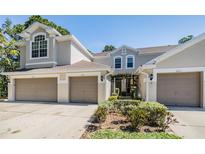 Beautiful townhome featuring a two-car garage and inviting curb appeal at 3621 Country Pointe Pl, Palm Harbor, FL 34684