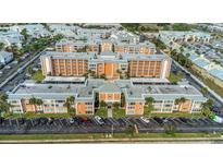Aerial view showcasing this beautiful condo community with lush landscaping and ample parking at 1900 68Th N St # 110, St Petersburg, FL 33710