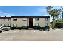A well-maintained two-story building with ample parking and lush landscaping at 601 N Keene Rd # P9, Clearwater, FL 33755