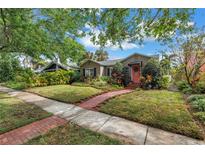 Charming single-story home with a beautifully landscaped front yard and brick walkway at 138 17Th N Ave, St Petersburg, FL 33704