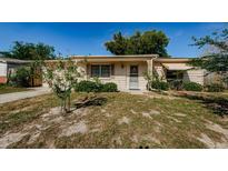 Charming single-story home with a well-maintained front yard and covered entry, blending comfort and curb appeal at 3815 Bowen St, New Port Richey, FL 34652