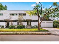 Modern two-story home with a manicured lawn and two-car garage at 4522 W North B St, Tampa, FL 33609
