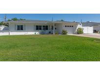 Charming single-story home with a well-maintained lawn and lovely curb appeal on a sunny day at 731 44Th Ne Ave, St Petersburg, FL 33703