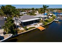 Waterfront home with a private dock and screened in lanai overlooking beautiful canal views at 9409 Sun Isle Ne Dr, St Petersburg, FL 33702